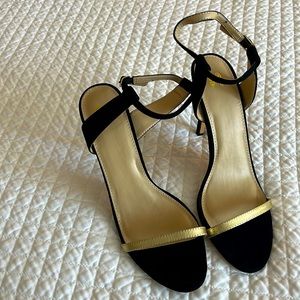 Sandals in Black suede and gold strap across front in gold. These are a size 10
